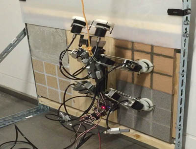 Semi-Autonomous Multi-Legged Robot with Suckers to Climb a Wall