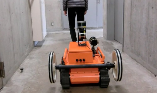 A crawler robot tracks a person automatically